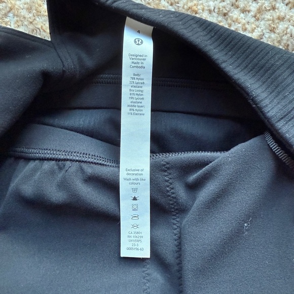 Lululemon Ribbed Nulu Asymmetrical Yoga Tank
Top in Black size 4 - Picture 2 of 6